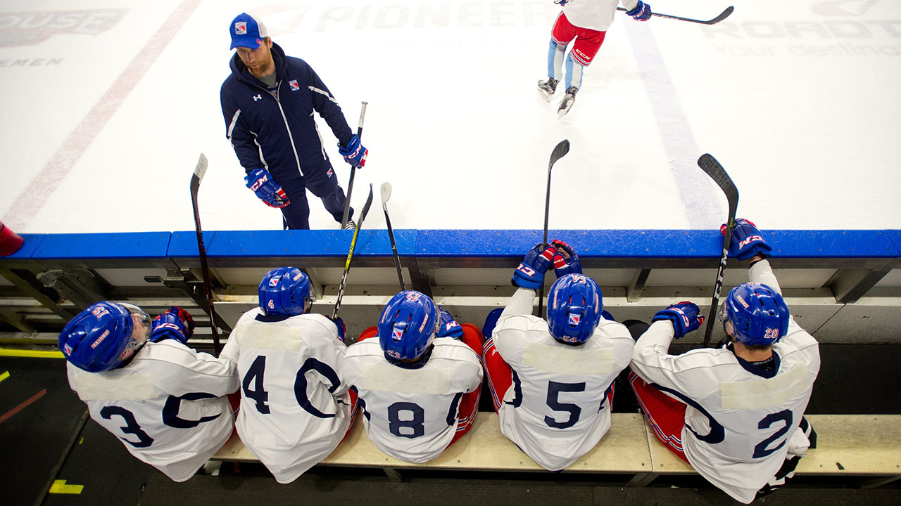 Dennis Wideman, Kitchener Rangers assistant coach, talks to players during practice